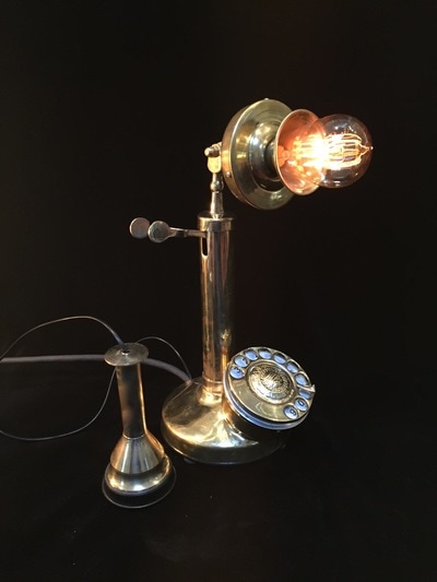 Vintage phone lamp featuring an Edison bulb. Lift receiver to illuminate, turn dial for dimmer