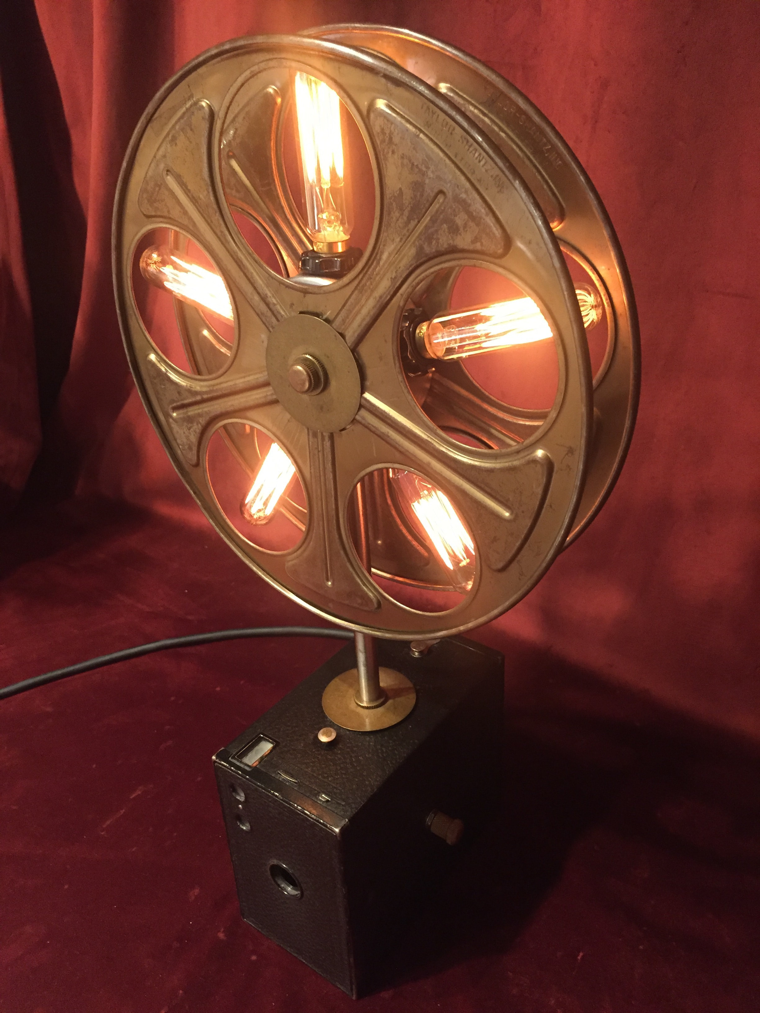 Movie Reel w/ Edison bulbs mounted on vintage box camera