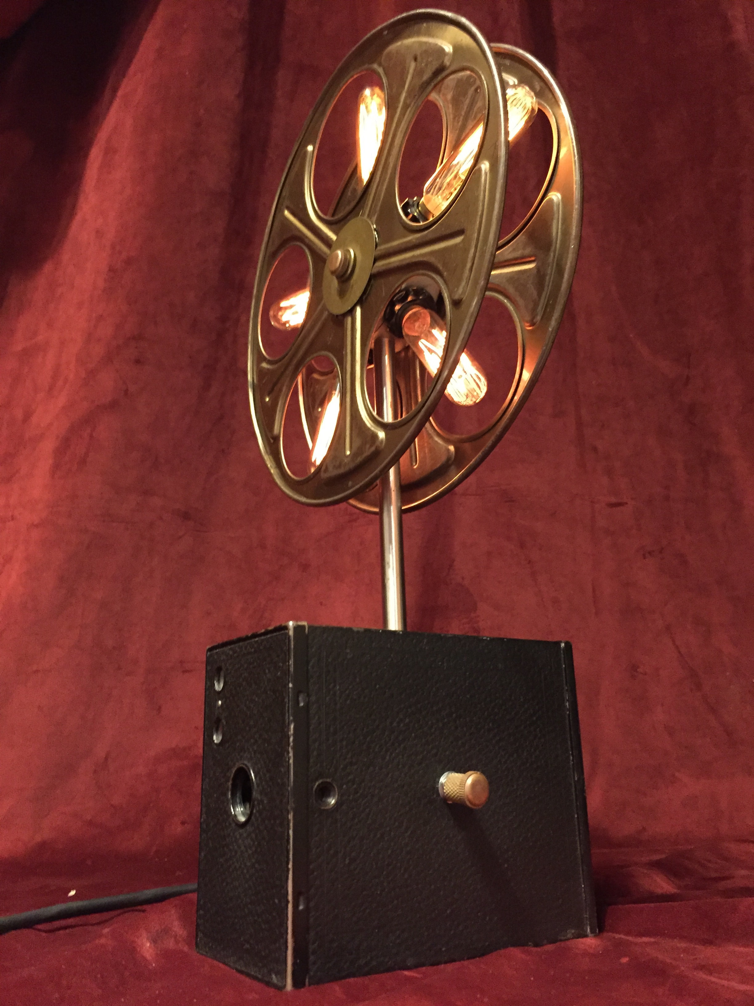 Movie Reel w/ Edison bulbs mounted on vintage box camera - Illuminated  Objects