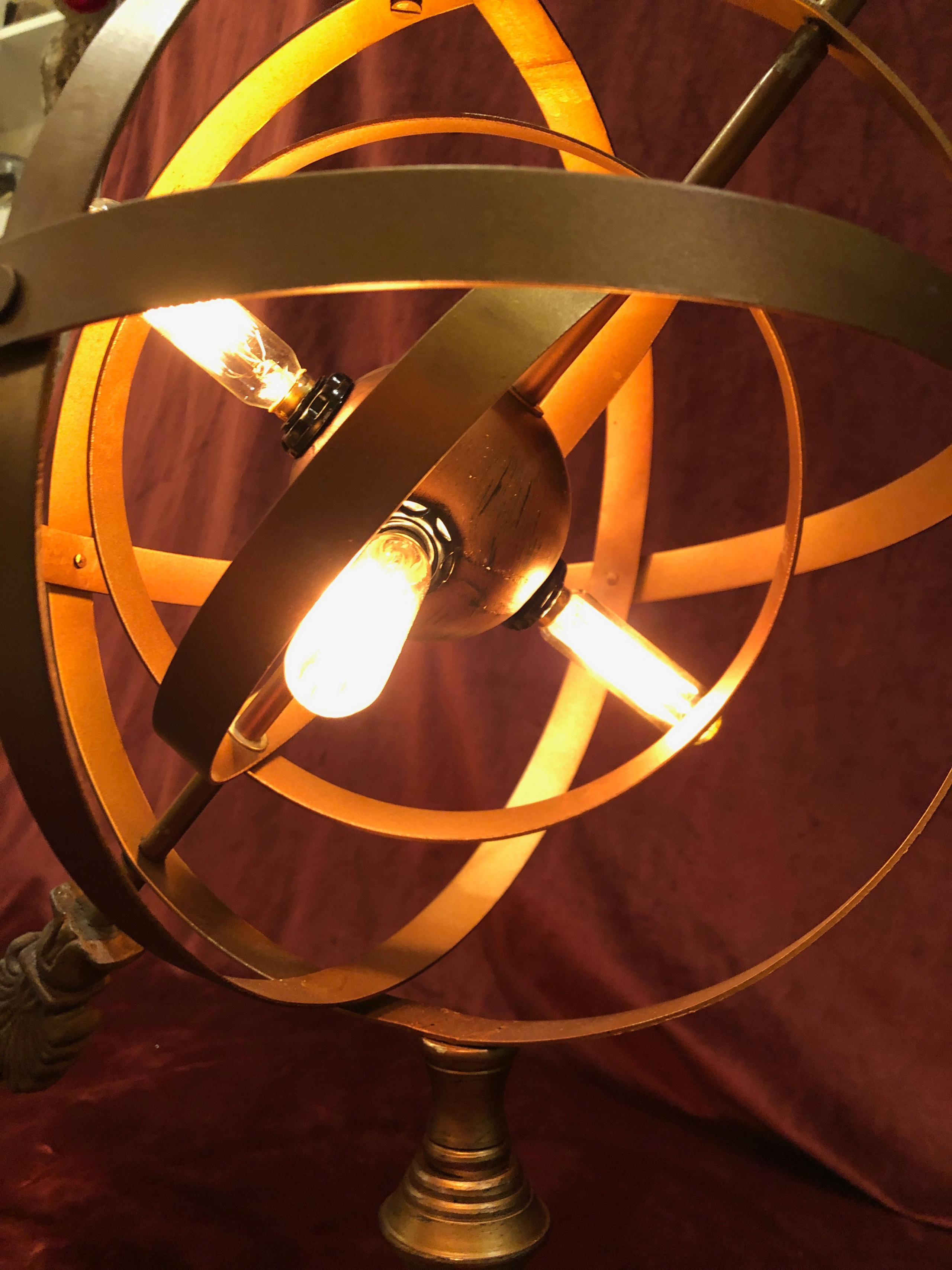 Striking Armillary globe with warm Edison bulb lighting, adjustable ...